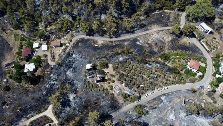 Aerial ciew reveals wildfire damage in Kumluca, Antalya ANTALYA, TURKIYE - JULY 30: An aerial view shows forested areas and buildings damaged by a wildfire that was brought under control in the Kumluca district of Antalya, on July 30, 2026 in Antalya, Turkiye. The fire left large areas of vegetation scorched and caused damage to properties in the affected region. Kasim Sakalli Anadolu Antalya Turkey. Editorial use only. Please get in touch for any other usage.  Copyright: x2026xAnadoluxKasimxSakallix