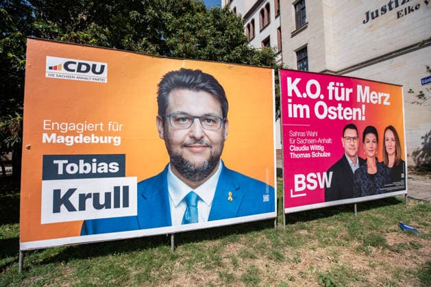 Wahlplakate von CDU mit Tobias Krull, der FDP und der BWS mit Sahra Wagenknecht, Claudia Wittig und Thomas Schulze in Magdeburg am 30. Juli 2026. Landtagswahlen in Sachsen-Anhalt *** Election posters for the CDU featuring Tobias Krull, the FDP, and the BWS featuring Sahra Wagenknecht, Claudia Wittig, and Thomas Schulze in Magdeburg on July 30, 2026, during the state elections in Saxony-Anhalt