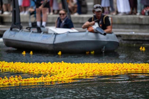 July 30, 2026, London, London, UK: LONDON, UK. Staff with leaf blowers and paddles coax three thousand sponsored rubber ducks to the finish of a charity rubber duck race in Merchant Square, Paddington Basin, raising funds for the paediatric intensive care unit at St MaryÃ¢â‚¬â ¢s Hospital through the charity COSMIC (Children of St Mary Intensive Care). Each duck has been sponsored by a member of the public. London UK  - ZUMAl94_ 20260730_zaf_l94_066 Copyright: xStephenxChungx