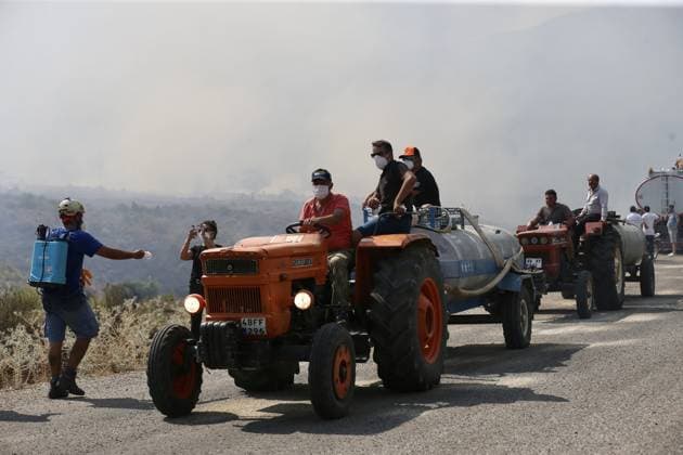 The forest fire in Fethiye, which had been brought under control, reignited due to the wind FETHIYE, TURKIYE - JULY 30: Firefighters, Turkish General Directorate of Forestry teams and forest workers continue their efforts from air and land to extinguish the fire that reignited due to the wind after having been brought under control in Fethiye district of Mugla, Turkiye on July 30, 2026. Ali Riza Akkir Anadolu Mugla Turkey. Editorial use only. Please get in touch for any other usage.  Copyright: x2026xAnadoluxAlixRizaxAkkirx