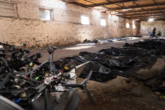 July 30, 2026, Kramatorsk, Donetsk Oblast, United Kingdom: Members of the Platsdarm body recovery team carry a body bag during an operation to recover the remains of a person killed amid the ongoing war in Donetsk region. Kramatorsk United Kingdom - ZUMAm350 20260730_zip_m350_006 Copyright: xCameronxJones-Manleyx