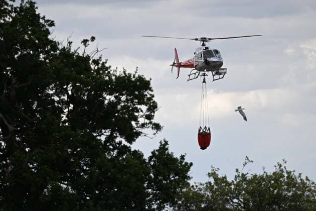 Heath fire breaks out in United Kingdom LEISTON, UNITED KINGDOM - JULY 30: Firefighters respond to a large wildfire and heath fire with helicopters at Dunwich Heath near Suffolk in Leiston, United Kingdom, on July 30, 2026. A major incident was declared after the blaze spread across approximately 100 hectares, prompting the evacuation of nearby areas. Rasid Necati Aslim Anadolu Leiston United Kingdom. Editorial use only. Please get in touch for any other usage.  Copyright: x2026xAnadoluxRasidxNecatixAslimx