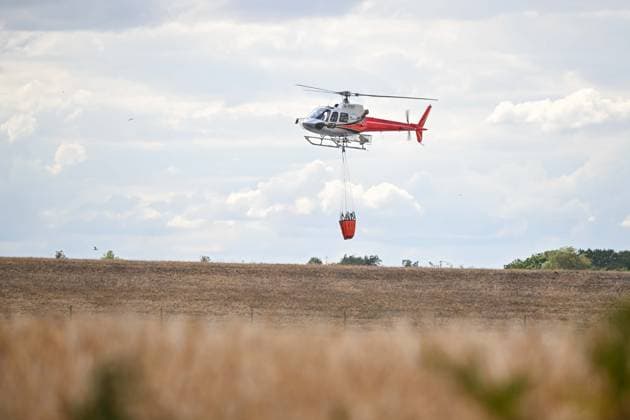 Heath fire breaks out in United Kingdom LEISTON, UNITED KINGDOM - JULY 30: Firefighters respond to a large wildfire and heath fire with helicopters at Dunwich Heath near Suffolk in Leiston, United Kingdom, on July 30, 2026. A major incident was declared after the blaze spread across approximately 100 hectares, prompting the evacuation of nearby areas. Rasid Necati Aslim Anadolu Leiston United Kingdom. Editorial use only. Please get in touch for any other usage.  Copyright: x2026xAnadoluxRasidxNecatixAslimx