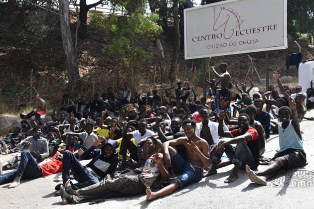 Hundreds of people are swimming across to Ceuta from Morocco, with a crowd waiting on the other side of the border. Dozens of people are waiting at the Temporary Immigrant Shelter (CETI), on July 30, 2026, in Ceuta, Spain. Hundreds of people of Maghreb origin have crossed into Ceuta from Morocco throughout the morning, either by swimming or by climbing the breakwater, and a crowd is waiting on the other side of the border to enter the autonomous city in the same way. Over the past week, more than 2,000 migrants have already done so. JULY 30, 2026 Europa Press 07 30 2026 Ceuta, Spain  Copyright: xEuropaxPressx 7695878