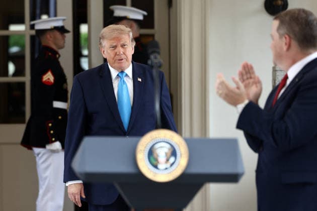 US President Trump makes an announcment on veterans eligiablity for the Freedom Haulers program Werner Enterprises President Nathan Meisgeier (R) as US President Donald Trump (L) arrives to announce a program to allow veterans to expedite a career in commercial trucking outside the White House in Washington, DC, USA, 30 July 2026. Known as the Freedom Haulers program, the initiative would allow any US veteran who drove heavy equipment to be automatically eligible for a commercial trucking license. WASHINGTON DC United States  Copyright: xPool ABACAx