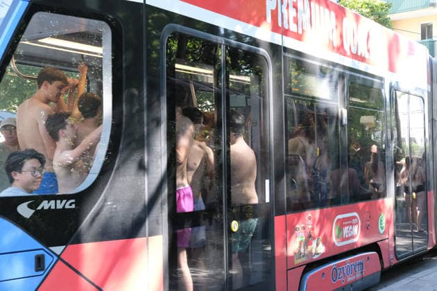 Munich residents ride trams in swimwear after cooling off in Eisbach, a summer routine in the city MUNICH, GERMANY - JULY 30: Passengers in swimwear ride a crowded tram after cooling off in the Eisbach river, as Munich residents traditionally do in summer, in Munich, Germany, on July 30, 2026. Munich records its hottest July 30 since 1947. Merve Goettl Anadolu Munich Germany. Editorial use only. Please get in touch for any other usage.  Copyright: x2026xAnadoluxMervexGoettlx