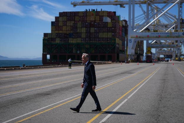 July 30, 2026, Delta, Bc, CANADA: Prime Minister Mark Carney walks past the Manzanillo Bridge container ship as he prepares to give a statement after touring Global Container Terminals Deltaport facility, at Roberts Bank in Delta, B.C., on Thursday, July 30, 2026. Delta CANADA  - ZUMAc35_ 20260730_zaf_c35_023 Copyright: xDarrylxDyckx