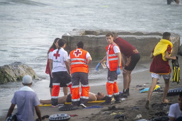 Hundreds of migrants reach Spain s Ceuta after swimming from Morocco CEUTA, SPAIN - JULY 30: (EDITORS NOTE: Image depicts death) Hundreds of migrants have attempted to swim from Morocco to the Spanish city of Ceuta in North Africa, while the number of arrivals exceeded 1,500 in just over a week, according to local news in Cueta, Spain on July 30, 2026. As Moroccan and Algerian migrants attempted to reach Ceuta by swimming, most were reportedly intercepted by Moroccan patrol boats. Spain s Maritime Rescue Service and the Spanish Red Cross rescued 117 people from the water, while the Civil Guard assisted around 200 others with patrol boats. The Spanish Civil Guard also found two bodies which raised the death toll along Ceuta s coastline so fa  Copyright: x2026xAnadoluxMarcosxMorenox