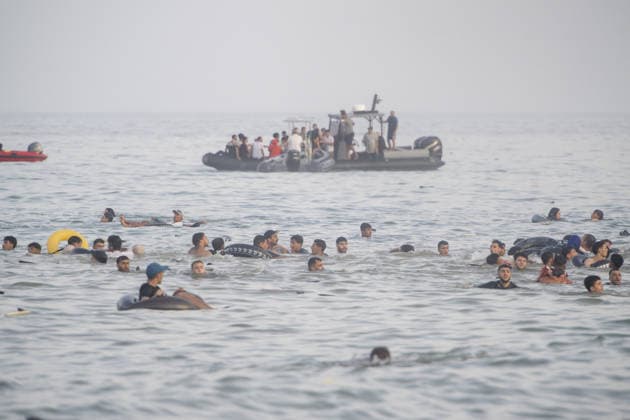 Hundreds of migrants reach Spain s Ceuta after swimming from Morocco CEUTA, SPAIN - JULY 30: Hundreds of migrants have attempted to swim from Morocco to the Spanish city of Ceuta in North Africa, while the number of arrivals exceeded 1,500 in just over a week, according to local news in Cueta, Spain on July 30, 2026. As Moroccan and Algerian migrants attempted to reach Ceuta by swimming, most were reportedly intercepted by Moroccan patrol boats. Spain s Maritime Rescue Service and the Spanish Red Cross rescued 117 people from the water, while the Civil Guard assisted around 200 others with patrol boats. The Spanish Civil Guard also found two bodies which raised the death toll along Ceuta s coastline so far this year to 29. Marcos Moreno A  Copyright: x2026xAnadoluxMarcosxMorenox