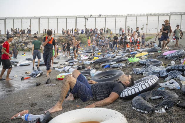 Hundreds of migrants reach Spain s Ceuta after swimming from Morocco CEUTA, SPAIN - JULY 30: (EDITORS NOTE: Image depicts death) Hundreds of migrants have attempted to swim from Morocco to the Spanish city of Ceuta in North Africa, while the number of arrivals exceeded 1,500 in just over a week, according to local news in Cueta, Spain on July 30, 2026. As Moroccan and Algerian migrants attempted to reach Ceuta by swimming, most were reportedly intercepted by Moroccan patrol boats. Spain s Maritime Rescue Service and the Spanish Red Cross rescued 117 people from the water, while the Civil Guard assisted around 200 others with patrol boats. The Spanish Civil Guard also found two bodies which raised the death toll along Ceuta s coastline so fa  Copyright: x2026xAnadoluxMarcosxMorenox