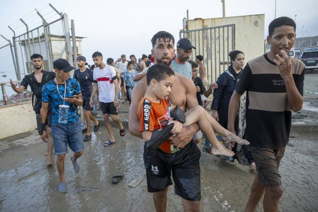 Hundreds of migrants reach Spain s Ceuta after swimming from Morocco CEUTA, SPAIN - JULY 30: Hundreds of migrants have attempted to swim from Morocco to the Spanish city of Ceuta in North Africa, while the number of arrivals exceeded 1,500 in just over a week, according to local news in Cueta, Spain on July 30, 2026. As Moroccan and Algerian migrants attempted to reach Ceuta by swimming, most were reportedly intercepted by Moroccan patrol boats. Spain s Maritime Rescue Service and the Spanish Red Cross rescued 117 people from the water, while the Civil Guard assisted around 200 others with patrol boats. The Spanish Civil Guard also found two bodies which raised the death toll along Ceuta s coastline so far this year to 29. Marcos Moreno A  Copyright: x2026xAnadoluxMarcosxMorenox