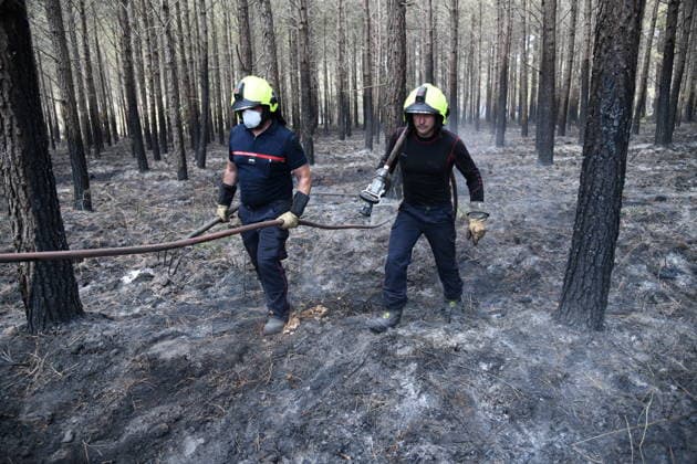 France continues wildfire battle as heat wave keeps Europe on alert BORDEAUX, FRANCE - JULY 30: Firefighters inspect and secure a wildfire-affected forest near Bordeaux, France, on July 30, 2026, as they continue operations to extinguish flare-ups and prevent the fire from reigniting. Fire crews remain deployed following the evacuation of nearby campsites and the closure of beaches due to the wildfire threat. Dragan Lekic Anadolu Bordeaux France. Editorial use only. Please get in touch for any other usage.  Copyright: x2026xAnadoluxDraganxLekicx