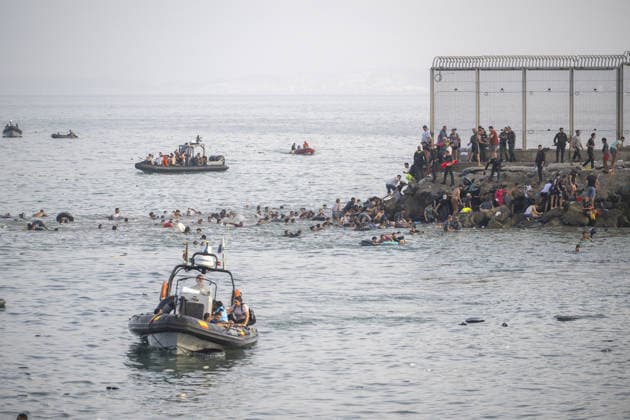 Hundreds of migrants reach Spain s Ceuta after swimming from Morocco CEUTA, SPAIN - JULY 30: Hundreds of migrants have attempted to swim from Morocco to the Spanish city of Ceuta in North Africa, while the number of arrivals exceeded 1,500 in just over a week, according to local news in Cueta, Spain on July 30, 2026. As Moroccan and Algerian migrants attempted to reach Ceuta by swimming, most were reportedly intercepted by Moroccan patrol boats. Spain s Maritime Rescue Service and the Spanish Red Cross rescued 117 people from the water, while the Civil Guard assisted around 200 others with patrol boats. The Spanish Civil Guard also found two bodies which raised the death toll along Ceuta s coastline so far this year to 29. Marcos Moreno A  Copyright: x2026xAnadoluxMarcosxMorenox