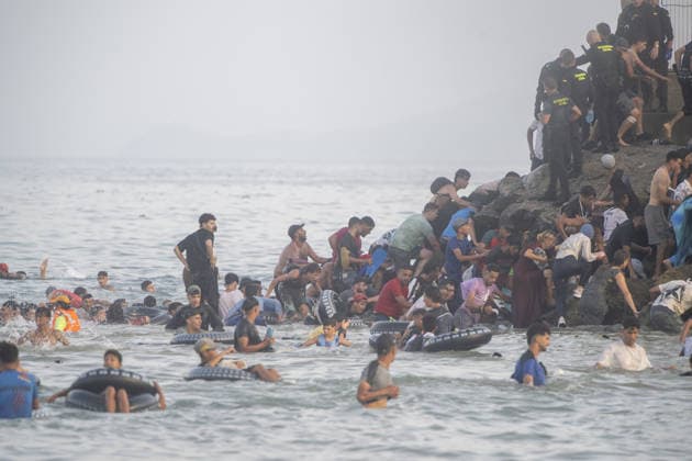 Hundreds of migrants reach Spain s Ceuta after swimming from Morocco CEUTA, SPAIN - JULY 30: Hundreds of migrants have attempted to swim from Morocco to the Spanish city of Ceuta in North Africa, while the number of arrivals exceeded 1,500 in just over a week, according to local news in Cueta, Spain on July 30, 2026. As Moroccan and Algerian migrants attempted to reach Ceuta by swimming, most were reportedly intercepted by Moroccan patrol boats. Spain s Maritime Rescue Service and the Spanish Red Cross rescued 117 people from the water, while the Civil Guard assisted around 200 others with patrol boats. The Spanish Civil Guard also found two bodies which raised the death toll along Ceuta s coastline so far this year to 29. Marcos Moreno A  Copyright: x2026xAnadoluxMarcosxMorenox