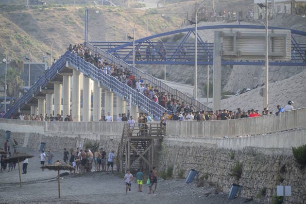 Hundreds of migrants reach Spain s Ceuta after swimming from Morocco CEUTA, SPAIN - JULY 30: Hundreds of migrants have attempted to swim from Morocco to the Spanish city of Ceuta in North Africa, while the number of arrivals exceeded 1,500 in just over a week, according to local news in Cueta, Spain on July 30, 2026. As Moroccan and Algerian migrants attempted to reach Ceuta by swimming, most were reportedly intercepted by Moroccan patrol boats. Spain s Maritime Rescue Service and the Spanish Red Cross rescued 117 people from the water, while the Civil Guard assisted around 200 others with patrol boats. The Spanish Civil Guard also found two bodies which raised the death toll along Ceuta s coastline so far this year to 29. Marcos Moreno A  Copyright: x2026xAnadoluxMarcosxMorenox