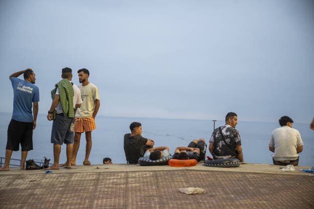 Migrants arrive on shore after attempting sea crossing to Ceuta from Morocco CEUTA, SPAIN - JULY 31: Migrants arrive on the shore of the Spanish city of Ceuta in North Africa after attempting to swim from Morocco on July 31, 2026. Moroccan and Algerian migrants attempted to reach Ceuta by sea, while many were intercepted by Moroccan patrol boats. Spain s Maritime Rescue Service, the Spanish Red Cross, and the Civil Guard carried out rescue operations after the attempted crossings. Marcos Moreno Anadolu Ceuta Spain. Editorial use only. Please get in touch for any other usage.  Copyright: x2026xAnadoluxMarcosxMorenox