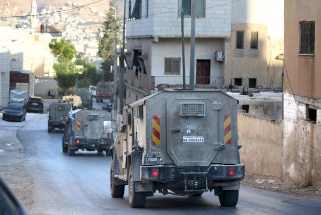 Palestinian-Israeli conflict - 31 Jul 2026 Israeli military vehicles withdrew after an Israeli army operation in the village of Salem, east of Nablus in the West Bank. The operation included raids and searches of Palestinian homes, resulting in the arrest of two brothers and a third person, following a heavy deployment of forces throughout the village. Nablus Palestine Copyright: xNasserxIshtayehx xSOPAxImagesx Nishtayeh239