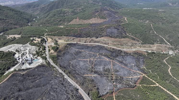 Aerial view shows fire-damaged forest area in Fethiye, Mugla MUGLA, TURKIYE - JULY 31: An aerial view shows the forested area damaged by a fire in the Fethiye district of Mugla, Turkiye on July 31, 2026. The wildfire left visible damage across the woodland area. Ali Riza Akkir Anadolu Mugla Turkey. Editorial use only. Please get in touch for any other usage.  Copyright: x2026xAnadoluxAlixRizaxAkkirx