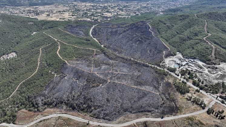 Aerial view shows fire-damaged forest area in Fethiye, Mugla MUGLA, TURKIYE - JULY 31: An aerial view shows the forested area damaged by a fire in the Fethiye district of Mugla, Turkiye on July 31, 2026. The wildfire left visible damage across the woodland area. Ali Riza Akkir Anadolu Mugla Turkey. Editorial use only. Please get in touch for any other usage.  Copyright: x2026xAnadoluxAlixRizaxAkkirx