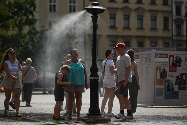 Heatwave in Poland KRAKOW, POLAND - JULY 31: People refresh themselfs by a water courtain due to high temperatures in Krakow, Poland on July 31, 2026. the Polish Institute of Meteorology and Water Management has issued orange heat warnings (the middle level on a three-tier scale) over parts of Poland as temperatures reach temperatures above 35 celcius degrees. Omar Marques Anadolu Krakow Poland. Editorial use only. Please get in touch for any other usage.  Copyright: x2026xAnadoluxOmarxMarquesx