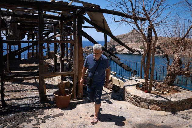 Aftermath of the devastating Crete wildfire CRETE, GREECE - JULY 31: Vangelis Datseris, the receptionist of a hotel damaged by the wildfire, walks through the hotel s premises after a wildfire at the village of Agios Pavlos, in the Rethymno region on the island of Crete, Greece, July 31, 2026. Costas Baltas Anadolu Crete Greece. Editorial use only. Please get in touch for any other usage.  Copyright: x2026xAnadoluxCostasxBaltasx
