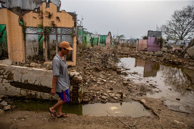 July 31, 2026, Lebak Regency, Banten, Indonesia: A man walks through the ruins of Somang village, which has re-emerged as water levels recede during the dry season, amid forecasts that El NioÂ±o may contribute to drier-than-normal conditions, at Karian Reservoir in Sajira district, Lebak Regency, Banten province, Indonesia, July 31, 2026. Lebak Regency Indonesia  - ZUMAp283 20260731_zip_p283_012 Copyright: xClaudioxPramanax