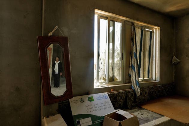 July 31, 2026, Zawtar Al-Gharbieh, Zawtar Al-Gharbieh, Lebanon: Lebanese Afaf Kadouh, is reflected in a mirror inside her devastated living room in the southern Lebanese village of Zawatar al-Gharbieh. Civilians started returning slowly the devastated hamlet after the army deployed inside the village following an Israeli withdrawal from several points inside it. Zawtar Al-Gharbieh Lebanon  - ZUMAn313 20260731_zip_n313_003 Copyright: xMarwanxNaamanix