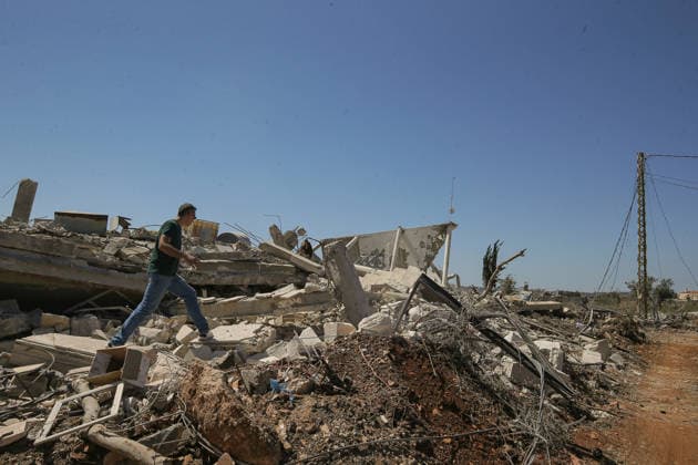 July 31, 2026, Zawtar Al-Gharbieh, Zawtar Al-Gharbieh, Lebanon: A Lebanese walks on rubble of a destroyed house in the southern Lebanese village of Zawatar al-Gharbieh. Civilians started returning slowly the devastated hamlet after the army deployed inside the village following an Israeli withdrawal from several points inside it. Zawtar Al-Gharbieh Lebanon  - ZUMAn313 20260731_zip_n313_023 Copyright: xMarwanxNaamanix