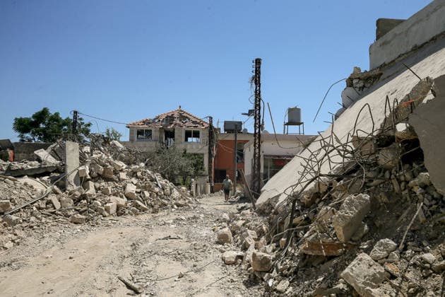July 31, 2026, Zawtar Al-Gharbieh, Zawtar Al-Gharbieh, Lebanon: A Lebanese walks among rubble of destroyed houses in the southern Lebanese village of Zawatar al-Gharbieh. Civilians started returning slowly the devastated hamlet after the army deployed inside the village following an Israeli withdrawal from several points inside it. Zawtar Al-Gharbieh Lebanon - ZUMAn313 20260731_zip_n313_018 Copyright: xMarwanxNaamanix