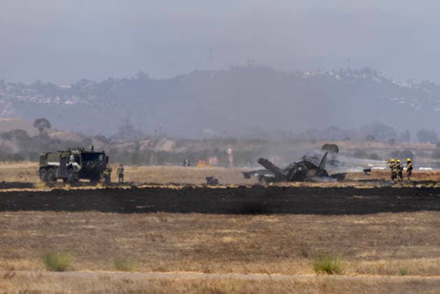 July 31, 2026, San Diego, Ca, United States: San Diego, CA - Crews work to douse a F-35 fighter jet that crashed near the run way at Marine Corps Air Station Miramar on Friday, July 31, 2026, in San Diego, CA. San Diego United States  - ZUMAs44_ 20260731_zaf_s44_001 Copyright: xLukejohnsonx