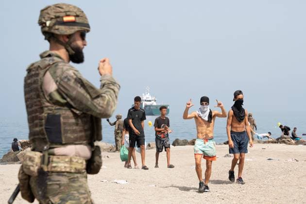 Heavy Migrant Movement at Ceuta Border CEUTA, SPAIN JULY 31, 2026: Migrants gather near the border crossing between Morocco and the Spanish enclave of Ceuta on July 31, 2026. Tens of thousands of migrants crossed into Ceuta from Morocco, while some continued to arrive and others voluntarily returned due to the precarious situation. Ceuta Spain Copyright: x xMarioxMoronx xJNAxPressx