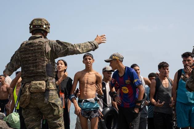 Heavy Migrant Movement at Ceuta Border CEUTA, SPAIN JULY 31, 2026: Migrants gather near the border crossing between Morocco and the Spanish enclave of Ceuta on July 31, 2026. Tens of thousands of migrants crossed into Ceuta from Morocco, while some continued to arrive and others voluntarily returned due to the precarious situation. Ceuta Spain Copyright: x xMarioxMoronx xJNAxPressx