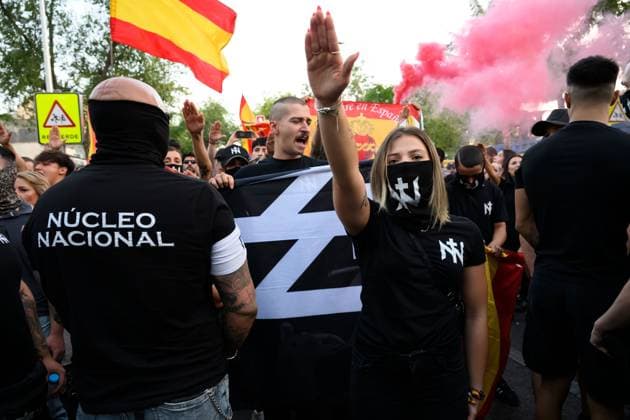 July 31, 2026, Madrid, Spain: MADRID, SPAIN Ã¢â‚¬ JULY 31, 2026: Participants attend a demonstration outside the Moroccan Embassy in Madrid, called by the far-right groups Falange EspaoÂ±ola and NoÂºcleo Nacional, following recent migrant arrivals through Spain s North African enclave of Ceuta. Protesters wave Spanish flags, display banners and chant slogans during the demonstration, while some participants are seen making gestures commonly associated with Nazi salutes. Madrid Spain - ZUMAq101 20260731_zna_q101_218 Copyright: xTomasxCallex