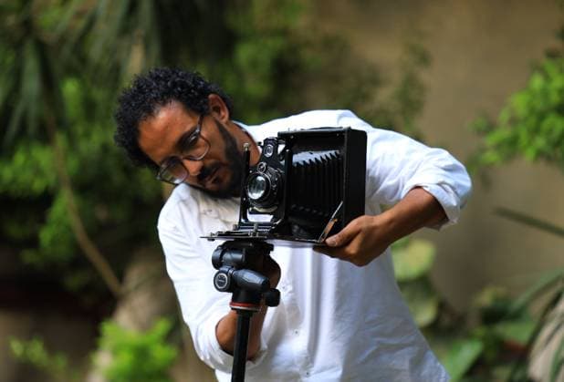 August 1, 2026, Cairo, Egypt: CAIRO, EGYPT Ã¢â‚¬ JULY 2026: Egyptian photojournalist Fareed Kotb poses with his restored 1930 Zeiss Ikon camera in Cairo, Egypt. Kotb gained international recognition for using the nearly century-old camera during his Project 1930, documenting the FIFA World Cup 2026 with a vintage camera manufactured in the same year as the inaugural FIFA World Cup. Cairo Egypt  - ZUMAq101 20260801_zna_q101_004 Copyright: xAbdullahxHamadax