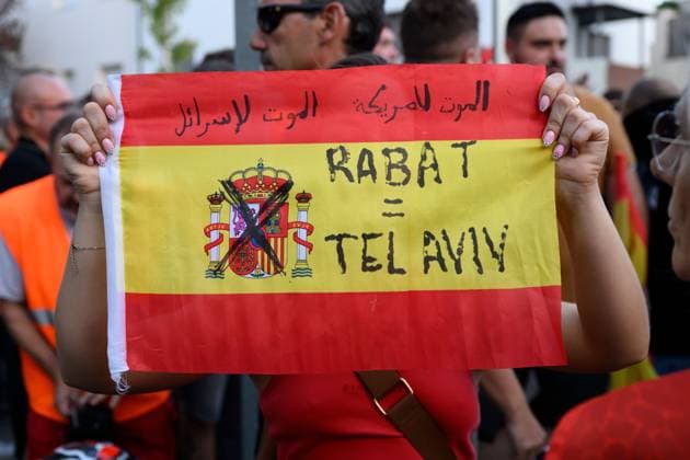 July 31, 2026, Madrid, Spain: MADRID, SPAIN Ã¢â‚¬ JULY 31, 2026: Participants attend a demonstration outside the Moroccan Embassy in Madrid, called by the far-right groups Falange EspaoÂ±ola and NoÂºcleo Nacional, following recent migrant arrivals through Spain s North African enclave of Ceuta. Protesters wave Spanish flags, display banners and chant slogans during the demonstration, while some participants are seen making gestures commonly associated with Nazi salutes. Madrid Spain - ZUMAq101 20260731_zna_q101_219 Copyright: xTomasxCallex