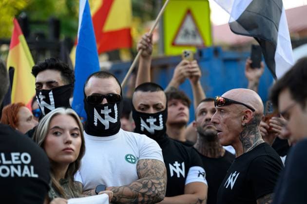July 31, 2026, Madrid, Spain: MADRID, SPAIN Ã¢â‚¬ JULY 31, 2026: Participants attend a demonstration outside the Moroccan Embassy in Madrid, called by the far-right groups Falange EspaoÂ±ola and NoÂºcleo Nacional, following recent migrant arrivals through Spain s North African enclave of Ceuta. Protesters wave Spanish flags, display banners and chant slogans during the demonstration, while some participants are seen making gestures commonly associated with Nazi salutes. Madrid Spain - ZUMAq101 20260731_zna_q101_229 Copyright: xTomasxCallex