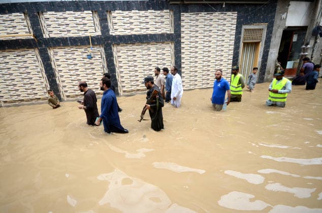 July 31, 2026, Peshawar, Peshawar, Pakistan: Residents wade through flooded street as monsoon rains inundate Peshawar..People wade through a flooded street during heavy monsoon rain in Peshawar, Khyber Pakhtunkhwa province, Pakistan, on July 31, 2026. Pakistan s Meteorological Department (PMD) forecast the current monsoon spell to continue until August 5, warning of widespread rain, thunderstorms, heavy to very heavy downpours, and the risk of urban flooding, flash floods, landslides and river flooding across parts of the country. Peshawar Pakistan - ZUMAa217 20260731_znp_a217_018 Copyright: xHussainxAlix