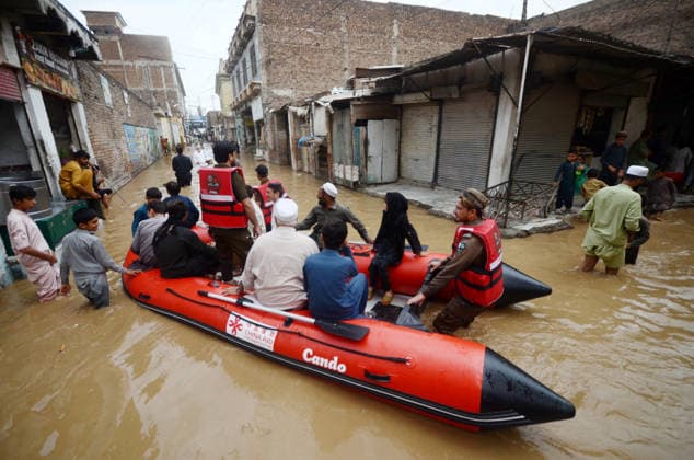 July 31, 2026, Peshawar, Peshawar, Pakistan: Residents wade through flooded street as monsoon rains inundate Peshawar..People wade through a flooded street during heavy monsoon rain in Peshawar, Khyber Pakhtunkhwa province, Pakistan, on July 31, 2026. Pakistan s Meteorological Department (PMD) forecast the current monsoon spell to continue until August 5, warning of widespread rain, thunderstorms, heavy to very heavy downpours, and the risk of urban flooding, flash floods, landslides and river flooding across parts of the country. Peshawar Pakistan  - ZUMAa217 20260731_znp_a217_024 Copyright: xHussainxAlix