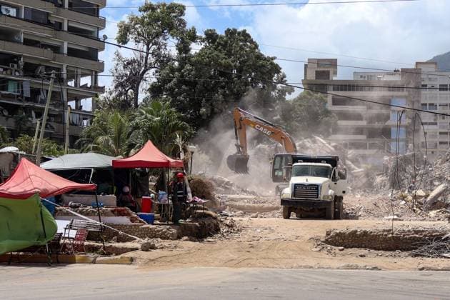 Cleanup operations continue in Caraballeda after disaster CARABALLEDA, LA GUAIRA, VENEZUELA JULY 30, 2026: Heavy machinery operates in the Caraballeda and Los Corales sectors of La Guaira state as crews carry out debris removal, sanitation work and ground leveling near residential areas. The continuous movement of dump trucks and earthmoving equipment reflects ongoing efforts to clear affected areas and prepare the terrain for recovery operations. La Guaira Venezuela (Bolivarian Republic of) Copyright: x xMarioxFloresx xJNAxPressx