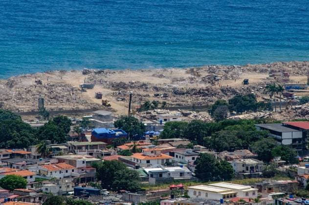 July 31, 2026, La Guaira, Venezuela (Bolivarian Republic of: CARABALLEDA, LA GUAIRA, VENEZUELA Ã¢â‚¬ JULY 30, 2026: Heavy machinery operates in the Caraballeda and Los Corales sectors of La Guaira state as crews carry out debris removal, sanitation work and ground leveling near residential areas. The continuous movement of dump trucks and earthmoving equipment reflects ongoing efforts to clear affected areas and prepare the terrain for recovery operations. La Guaira Venezuela (Bolivarian Republic of - ZUMAq101 20260731_zna_q101_247 Copyright: xMarioxFloresx
