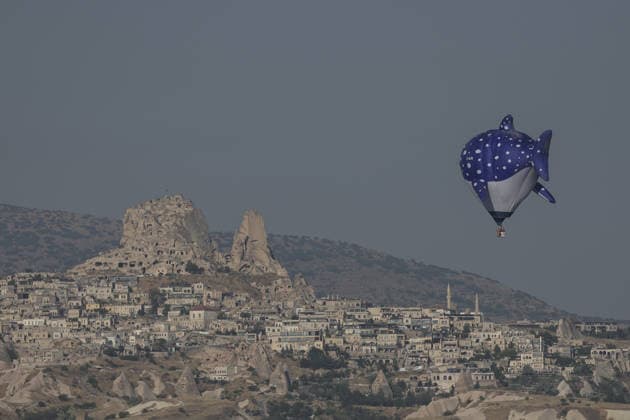 7th Cappadocia Balloon Festival NEVSEHIR, TURKIYE - AUGUST 01: Figure-shaped hot air balloons float above Cappadocia s fairy chimneys during the seventh Cappadocia Balloon Festival, on August 01, 2026 in Nevsehir, Turkiye. Organized by the Ministry of Culture and Tourism, the festival features 30 specially designed balloons brought from Turkiye and several other countries. During sunrise demonstration flights over Goreme, balloons shaped like hearts, owls, parrots, rockets and the Earth attracted the attention of local and international visitors. Osmancan Gurdogan Anadolu Nevsehir Turkey. Editorial use only. Please get in touch for any other usage.  Copyright: x2026xAnadoluxOsmancanxGurdoganx