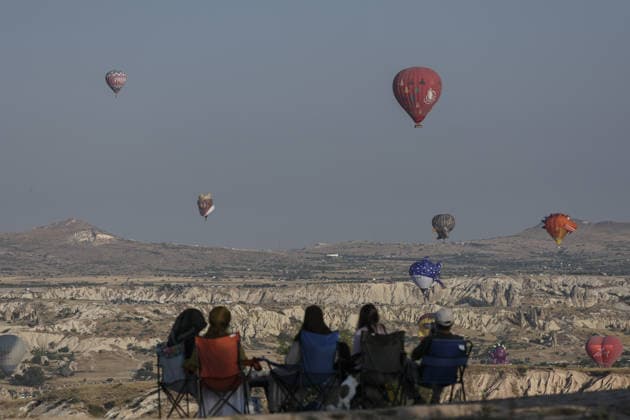7th Cappadocia Balloon Festival NEVSEHIR, TURKIYE - AUGUST 01: Figure-shaped hot air balloons float above Cappadocia s fairy chimneys during the seventh Cappadocia Balloon Festival, on August 01, 2026 in Nevsehir, Turkiye. Organized by the Ministry of Culture and Tourism, the festival features 30 specially designed balloons brought from Turkiye and several other countries. During sunrise demonstration flights over Goreme, balloons shaped like hearts, owls, parrots, rockets and the Earth attracted the attention of local and international visitors. Osmancan Gurdogan Anadolu Nevsehir Turkey. Editorial use only. Please get in touch for any other usage.  Copyright: x2026xAnadoluxOsmancanxGurdoganx