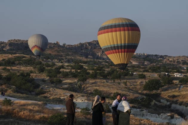 7th Cappadocia Balloon Festival NEVSEHIR, TURKIYE - AUGUST 01: Figure-shaped hot air balloons float above Cappadocia s fairy chimneys during the seventh Cappadocia Balloon Festival, on August 01, 2026 in Nevsehir, Turkiye. Organized by the Ministry of Culture and Tourism, the festival features 30 specially designed balloons brought from Turkiye and several other countries. During sunrise demonstration flights over Goreme, balloons shaped like hearts, owls, parrots, rockets and the Earth attracted the attention of local and international visitors. Osmancan Gurdogan Anadolu Nevsehir Turkey. Editorial use only. Please get in touch for any other usage.  Copyright: x2026xAnadoluxOsmancanxGurdoganx