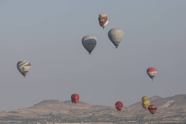 7th Cappadocia Balloon Festival NEVSEHIR, TURKIYE - AUGUST 01: Figure-shaped hot air balloons float above Cappadocia s fairy chimneys during the seventh Cappadocia Balloon Festival, on August 01, 2026 in Nevsehir, Turkiye. Organized by the Ministry of Culture and Tourism, the festival features 30 specially designed balloons brought from Turkiye and several other countries. During sunrise demonstration flights over Goreme, balloons shaped like hearts, owls, parrots, rockets and the Earth attracted the attention of local and international visitors. Osmancan Gurdogan Anadolu Nevsehir Turkey. Editorial use only. Please get in touch for any other usage.  Copyright: x2026xAnadoluxOsmancanxGurdoganx