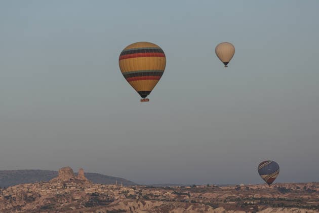7th Cappadocia Balloon Festival NEVSEHIR, TURKIYE - AUGUST 01: Figure-shaped hot air balloons float above Cappadocia s fairy chimneys during the seventh Cappadocia Balloon Festival, on August 01, 2026 in Nevsehir, Turkiye. Organized by the Ministry of Culture and Tourism, the festival features 30 specially designed balloons brought from Turkiye and several other countries. During sunrise demonstration flights over Goreme, balloons shaped like hearts, owls, parrots, rockets and the Earth attracted the attention of local and international visitors. Osmancan Gurdogan Anadolu Nevsehir Turkey. Editorial use only. Please get in touch for any other usage.  Copyright: x2026xAnadoluxOsmancanxGurdoganx