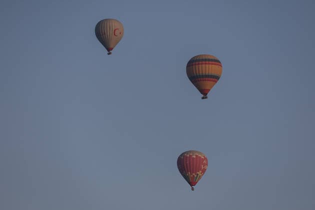 7th Cappadocia Balloon Festival NEVSEHIR, TURKIYE - AUGUST 01: Figure-shaped hot air balloons float above Cappadocia s fairy chimneys during the seventh Cappadocia Balloon Festival, on August 01, 2026 in Nevsehir, Turkiye. Organized by the Ministry of Culture and Tourism, the festival features 30 specially designed balloons brought from Turkiye and several other countries. During sunrise demonstration flights over Goreme, balloons shaped like hearts, owls, parrots, rockets and the Earth attracted the attention of local and international visitors. Osmancan Gurdogan Anadolu Nevsehir Turkey. Editorial use only. Please get in touch for any other usage.  Copyright: x2026xAnadoluxOsmancanxGurdoganx