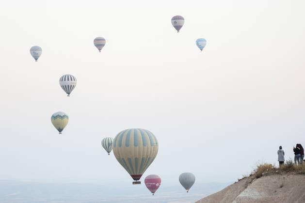 7th Cappadocia Balloon Festival NEVSEHIR, TURKIYE - AUGUST 01: Figure-shaped hot air balloons float above Cappadocia s fairy chimneys during the seventh Cappadocia Balloon Festival, on August 01, 2026 in Nevsehir, Turkiye. Organized by the Ministry of Culture and Tourism, the festival features 30 specially designed balloons brought from Turkiye and several other countries. During sunrise demonstration flights over Goreme, balloons shaped like hearts, owls, parrots, rockets and the Earth attracted the attention of local and international visitors. Osmancan Gurdogan Anadolu Nevsehir Turkey. Editorial use only. Please get in touch for any other usage.  Copyright: x2026xAnadoluxOsmancanxGurdoganx