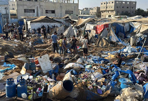 Displaced Palestinians inspect damage after Israeli strike in Deir al-Balah Displaced Palestinians inspect the damage to their tents and belongings following an Israeli airstrike that targeted the medical supplies and pharmaceuticals warehouse of Al-Aqsa Martyrs Hospital in Deir al-Balah, central Gaza Strip, on August 1, 2026. The strike caused extensive destruction to the warehouse and to tents sheltering displaced Palestinians near the targeted site. Photo by Ahmed Ibrahim apaimages Deir al-Balah Gaza Palestinian Territory 010826_Deir_al-Balah_AI_00(35) Copyright: xapaimagesxAhmedxIbrahimx xapaimagesx
