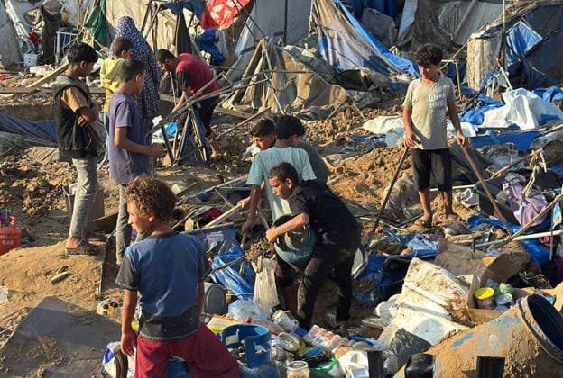 Displaced Palestinians inspect damage after Israeli strike in Deir al-Balah Displaced Palestinians inspect the damage to their tents and belongings following an Israeli airstrike that targeted the medical supplies and pharmaceuticals warehouse of Al-Aqsa Martyrs Hospital in Deir al-Balah, central Gaza Strip, on August 1, 2026. The strike caused extensive destruction to the warehouse and to tents sheltering displaced Palestinians near the targeted site. Photo by Ahmed Ibrahim apaimages Deir al-Balah Gaza Palestinian Territory 010826_Deir_al-Balah_AI_00(6) Copyright: xapaimagesxAhmedxIbrahimx xapaimagesx
