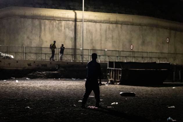 August 1, 2026, Ceuta, Spain: CEUTA, SPAIN - AUGUST 1, 2026: The arrival of migrants across the Tarajal border continues during the early hours of Saturday morning in Ceuta. Authorities maintain security and monitoring devices at the border crossing amid the ongoing influx. Ceuta Spain  - ZUMAq101 20260801_zna_q101_057 Copyright: xSamuelxVegax